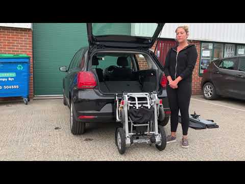 How to lift an electric folding wheelchair in a car.