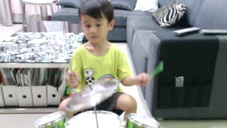 My little Coltrane playing drums on Coltrane's "Mr. Knight"
