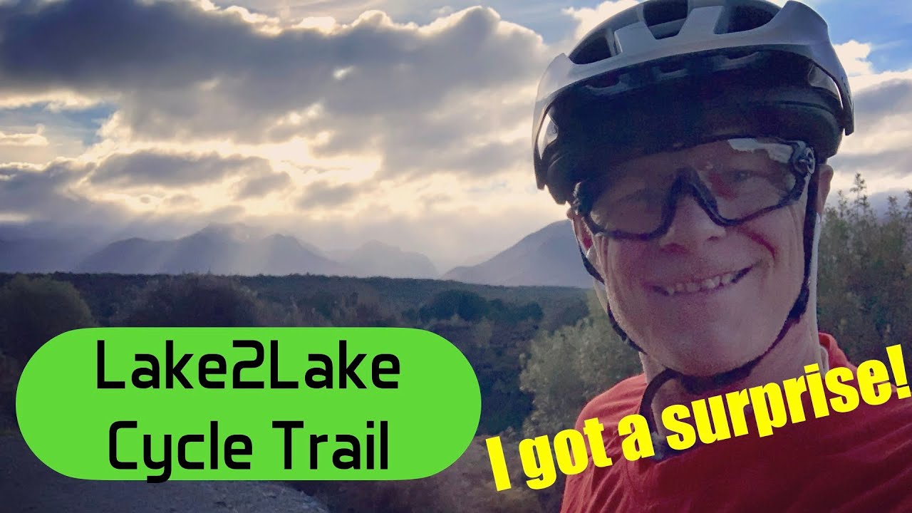 A traveler cycles through Lake2Lake Cycle Trail.