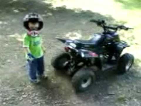 2.5 year old jumping his 110 cc china quad, wheeler