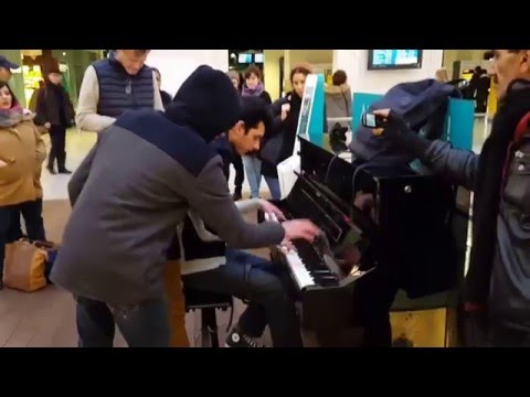 Amazing improvisation piano players at train station in Paris