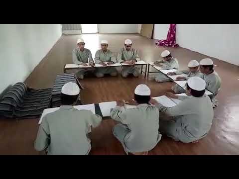 Blind children is reading Quran