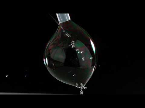 The Beauty of Slow Motion - Why can water drops pass through a soap bubble?