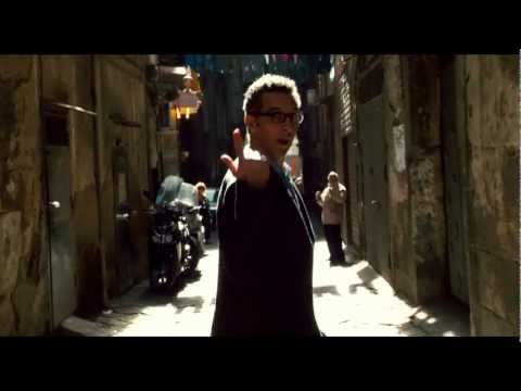 Behind-the-scenes vibe from trailer frames: camera gliding through Naples alleys into impromptu stages