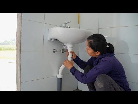 Overcoming the challenge: I installed the bathroom fixtures and water supply system myself.