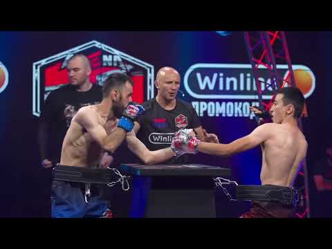 Two Russian Boxers Fight While Strapped To A Table In Bizarre Format Dubbed 'Arm Boxing'