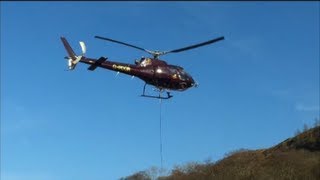 preview picture of video 'Eurocopter AS350 B2 PDG Helicopter Lifting Load West Highland Way Path Loch Lomond Scotland Feb 2013'