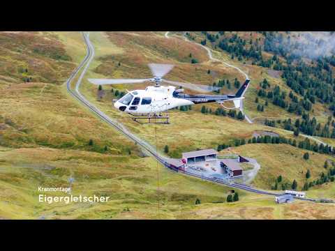 Kran Montage Eigergletscher, BEO Helicopter. Assembly of crane with help of Ecureuil helicopter.