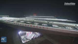 Download the video "New record! Four bridges rotate simultaneously above busy rail line"