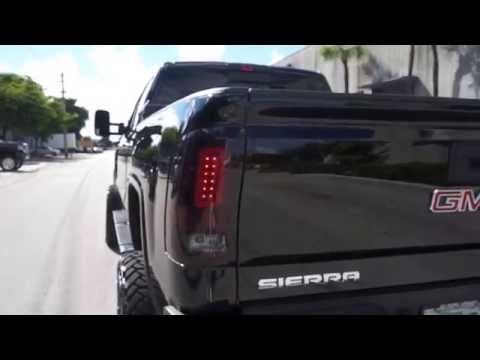 RECON Part # 264239RBK Red Smoked LED Tail Lights installed on a Black 2015 GMC Sierra HD