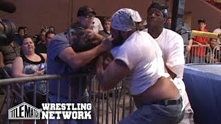 Wrestling Gone Wrong: Fan Fights Wrestler in the Crowd!