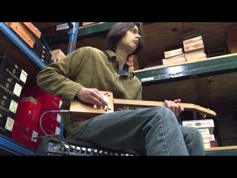 Rainor tries out the "2-cent Genny" Cigar Box Guitar