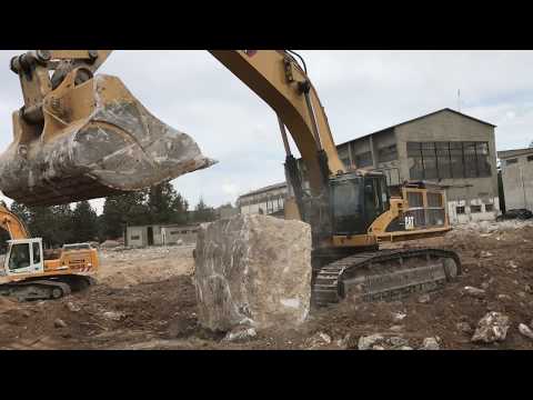 Cat 385C Excavator Loading Huge Concrete Blocks On Dumpers - Kyvos Atevee