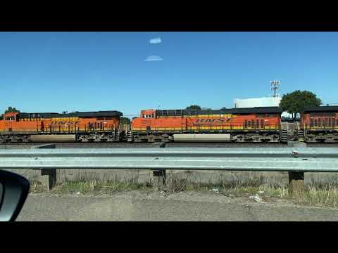 An Incoming BNSF Short Container Freight Train Racing At Main St In My Hometown In 4K
