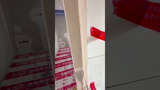 Download lagu using a small metal scraper to apply a smooth layer of grey cement onto a narrow indoor wall corner mp3