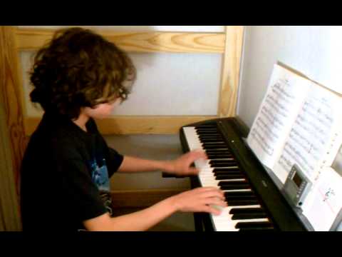 Elijah Valongo playing Bach Minuet piece on piano