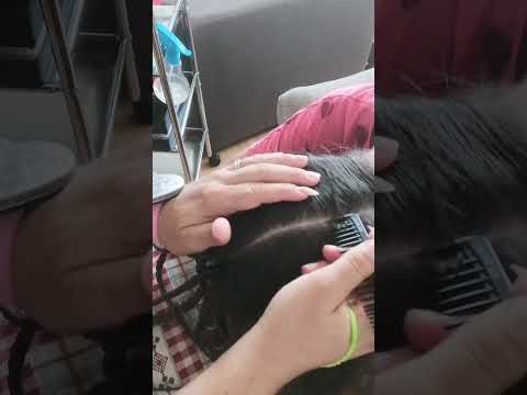 The process of making 'octopus' (braided high ponytail) from natural hair.