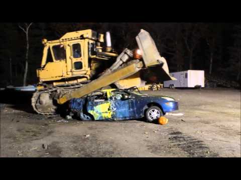Crush a car with a bulldozer