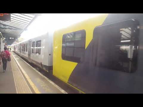 that is a SWR train NHS 450067 and a NHS pride 444019 in guildford