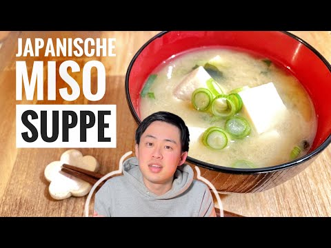 A Japanese man is cooking miso soup