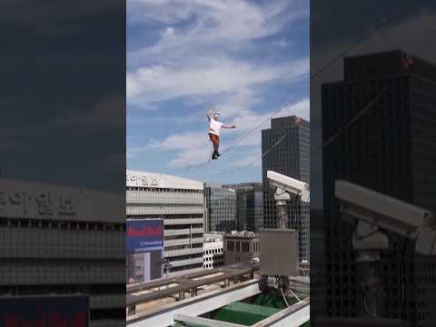 Estonian slackline champion walks between buildings
