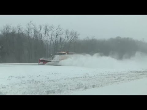 Commuters contend not just with heavy snow but high winds and frigid air