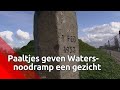 Paaltjes geven watersnoodramp een gezicht