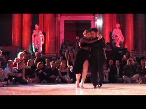  Carlos Espinoza  and  Noelia Hurtado Pitruzzella  are  dancing  to  the  vals  "  Violetas  "  by  Alberto Castillo  at  Genova Festival Bravo  in  2019