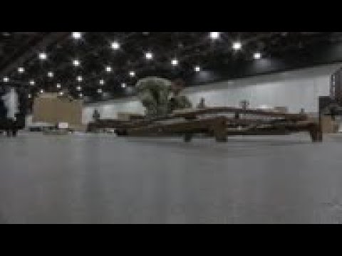Workers building field hospital in Detroit center