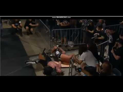 Kenny Omega dragon suplex on Tomhiro Ishii through table