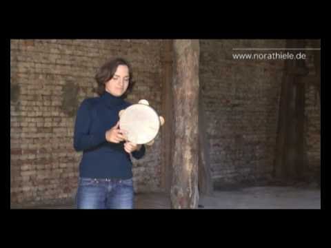 Nora Thiele plays Riq