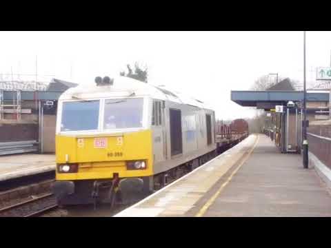 DB silver Drax power 60066 on a steel train through Tamworth high level