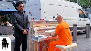 Prisoner in handcuffs plays street piano to confused audience