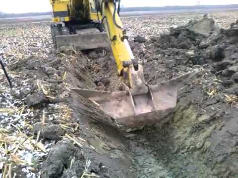 Kopanie rowu CAT 206