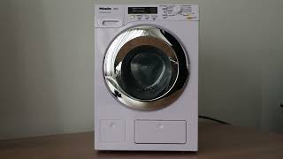 Spinning Miele (toy) washing program and spinning with water