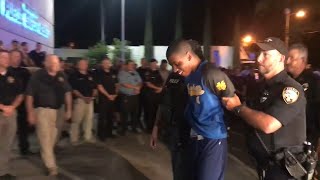Teen accused of killing Biloxi officer escorted into police station