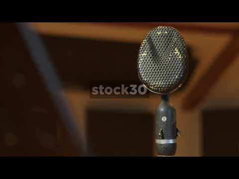 Close Up Shots Of Neumann U87 And Coles 4038 Microphones In Recording Studio