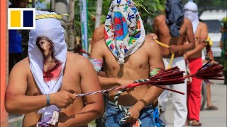 Filipino Catholics whip their backs in repentance ahead of Easter Sunday