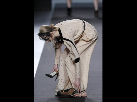 Model falls down and loses her shoes during Miguel Palacio Fall/Winter 2012-2013 fashion show