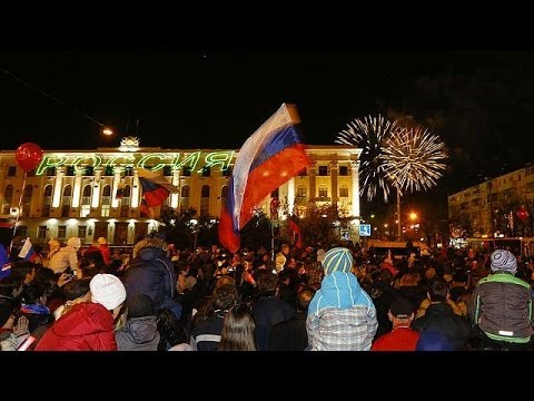 Celebrations in Crimea and Moscow as annexation treaty signed