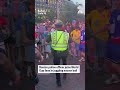 Police officer juggles soccer ball with World Cup fans - Video