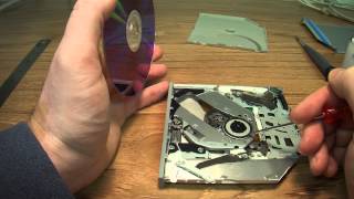 How to remove a CD Rom Disk that is stuck in a slot loading Apple