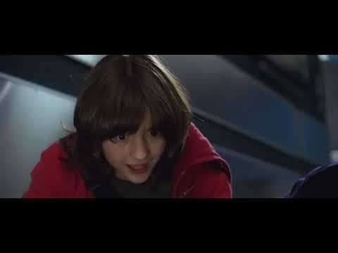 Official Unaccompanied Minors trailer thumbnail — snowed-in airport chaos setting up the soundtrack’s holiday palette