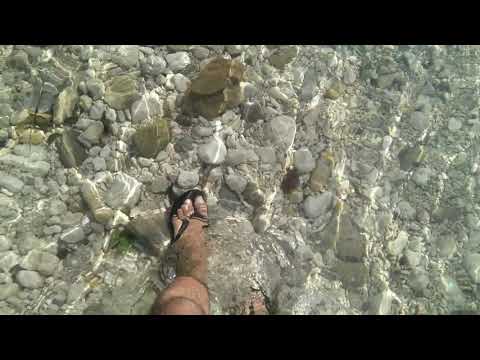 Walk in Crystal clear water - royalty free stock footage