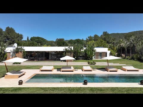 To rent, this modern Ibiza villa is framed by ten lush acres of land