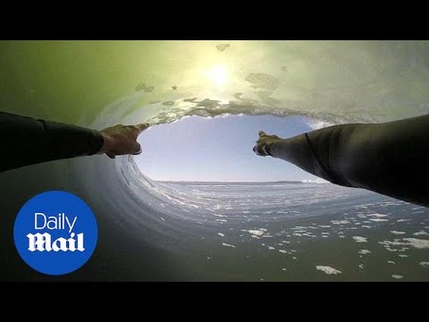Surfer travels through an epic 8-barrel wave in Africa