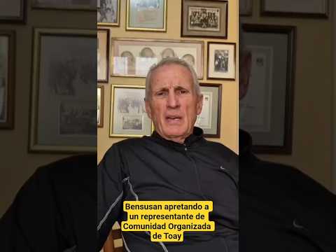 Bensusan apretando a un representante de Comunidad Organizada de Toay