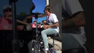 Dani Washington from Neck Deep playing serpents backstage warped tour 2017