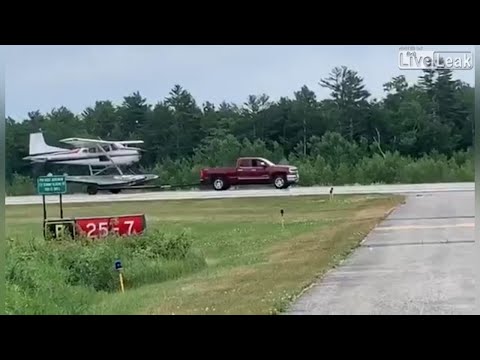 Pickup truck helps plane taking off.