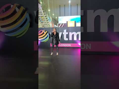 Tropicalia lady singing in a London WTM stage
